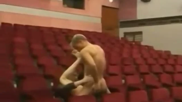 Young gay orgy in auditorium