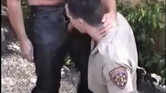 Cop sucks on leather cock