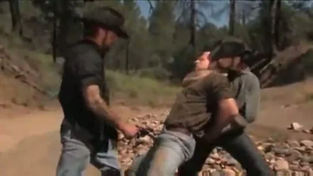 Cowboy fucked by two bandits