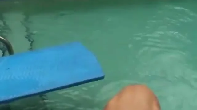 Naked boy in the pool