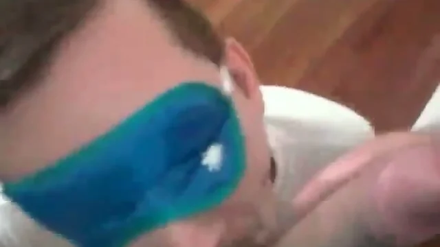 Blindfolded guy sucks dick