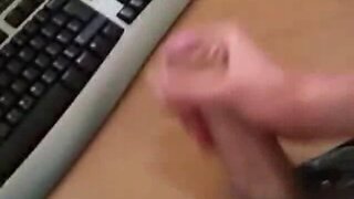 Sexy guy jerks off to a computer