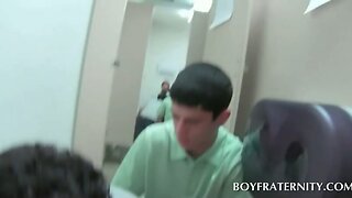 Two gay students blowing cock in mens room