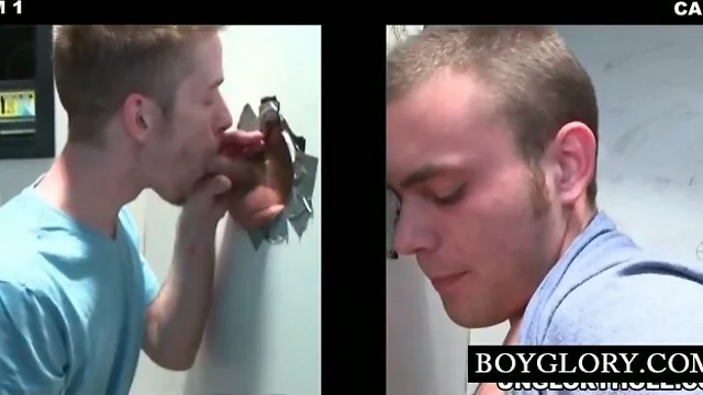 Lusty teen guy having gay oral sex on gloryhole