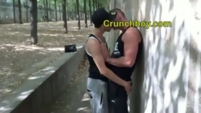 a arab teenager suck a sporty teenager in a public park