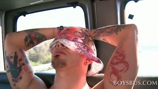 Blindfolded tattooed stud gets cock gay blown in the bus