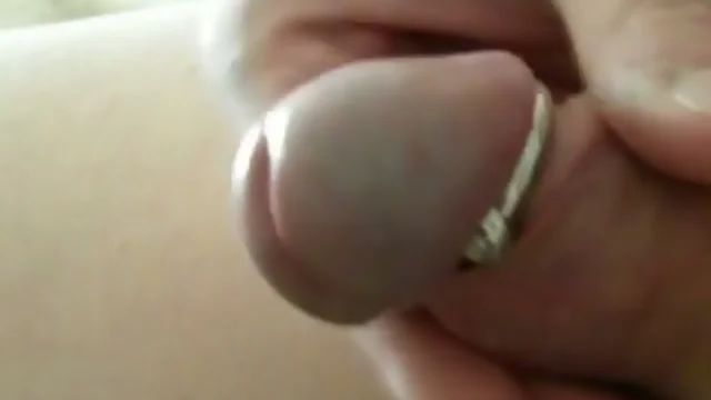 Closeup masturbating with glans ring - dripping and spurting sperm