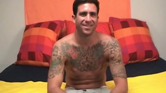 Tattooed dude masturbating