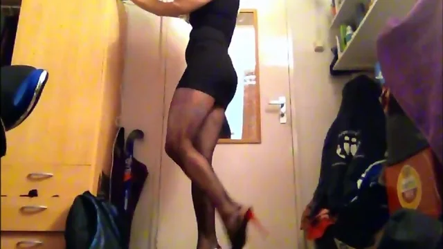 Sexy Sasha in black dress, fishnet pantyhose and high heels