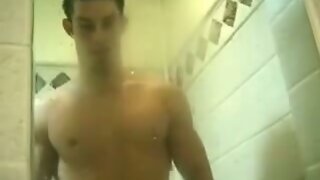 Sexy Jock blows a load on shower door