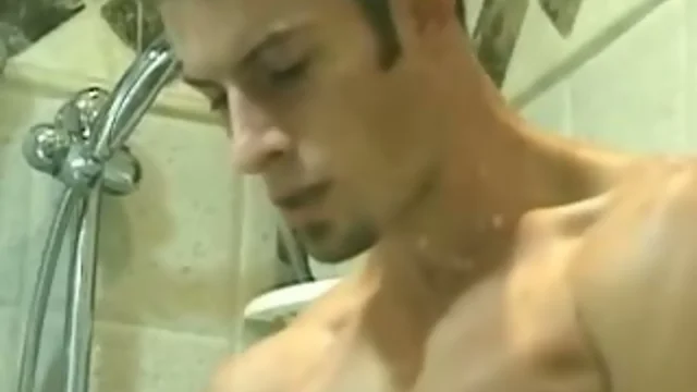 Sexy Jock blows a load on shower door