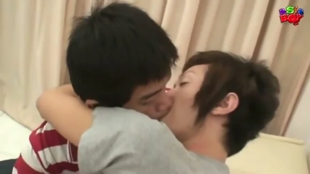 Two lovely asiatic boys sipping penis