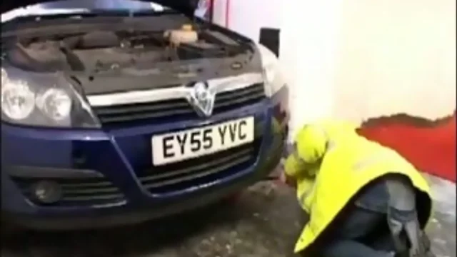 Teenage car mechanic servicing older gay businessman