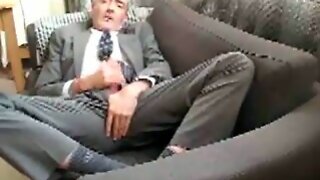 Appealing grandpa in suit and socks