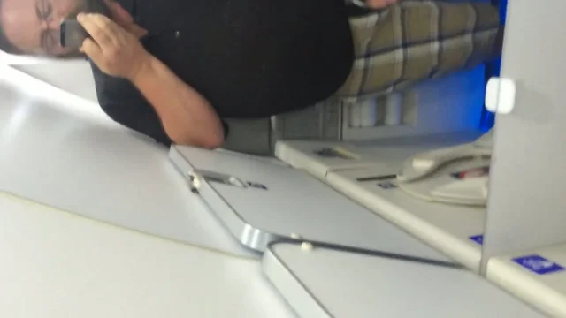 Chub stroking in an airplane bathroom
