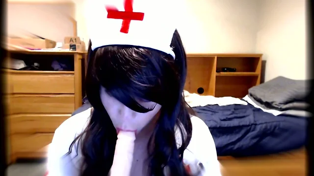 Cute Crossdresser Nurse Blows Dildo