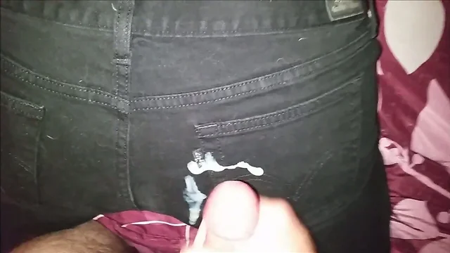 Cumshot on black jeans