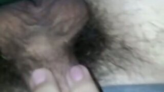 Playing with soft hairy cock