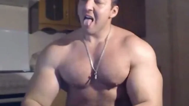 Very handsome muscular man posing and jerking off