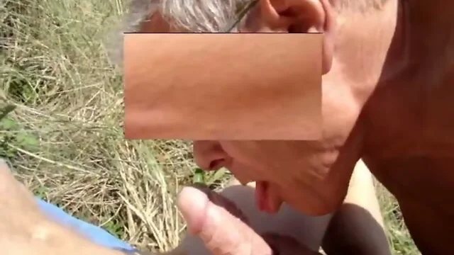 old man blows his friends cock in the dunes