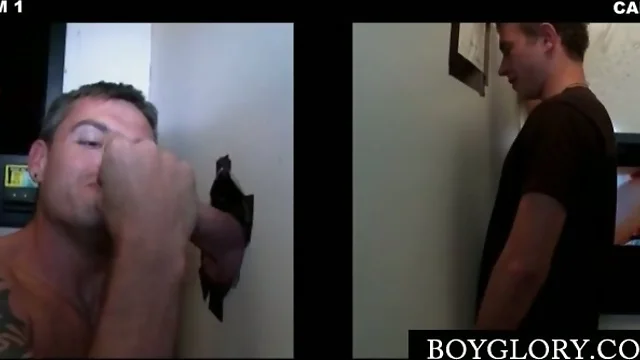 Hot dude gets cock gay sucked and cums on gloryhole