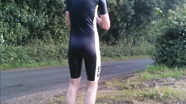 Latex cycling skinsuit in the rain