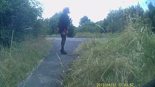 Crossdressed in black stockings in public path by road