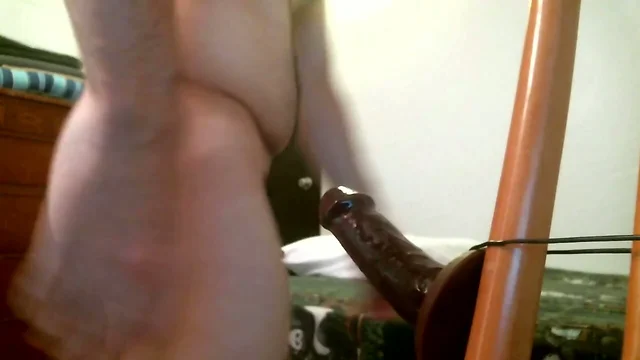 Sucking and fucked by black dildo