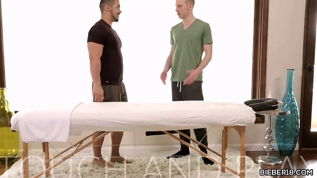 Gay man gives massage and blowjob to a twink
