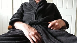 Mature man in robe masturbating to a porn video. (cumshot)
