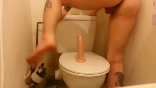 Horny FtM stretching his ass and pussy with a big dildo