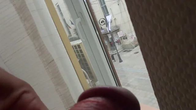 A Naughty Peep Show: Watch Him Flash His Body Through the Window!