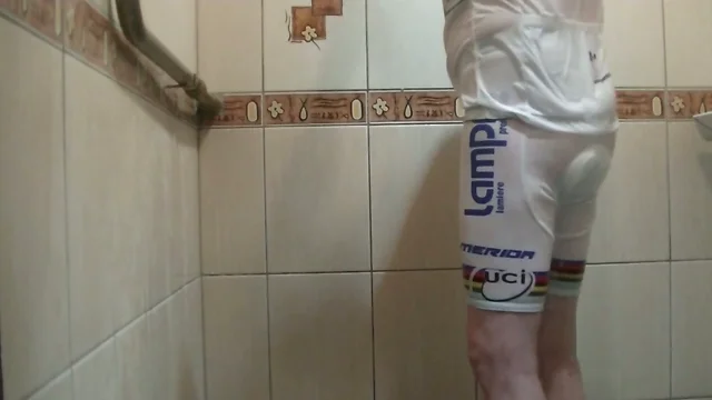 Masturbating under shower in white bicycle clothing