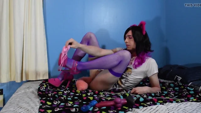 Ashley Sissykins plays with her toy rex