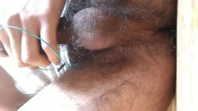 Pierced dick cumming on wire