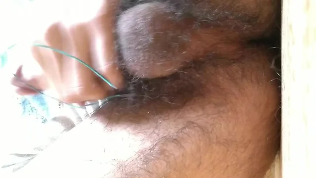 Pierced dick cumming on wire