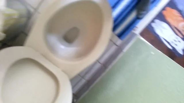 Fat boy rubs his stubby cock and cums into the toilet