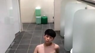 Asiatic teenage wank in public toilet