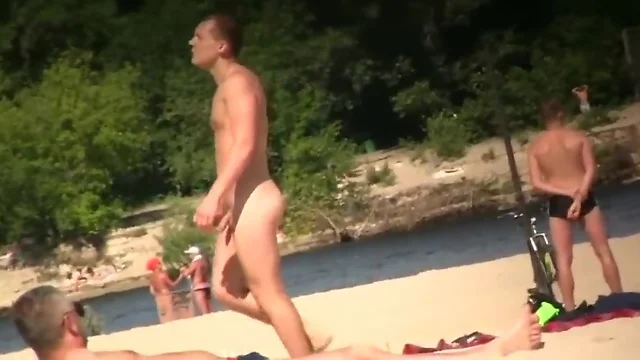 Men enjoying being nude at the nudist beach