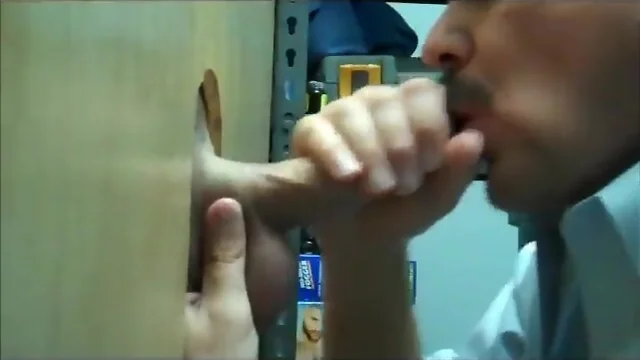 Moustache daddy blows a long cock at glory hole