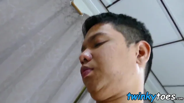 Oriental twinkie sucks small toes before riding man-sized cock