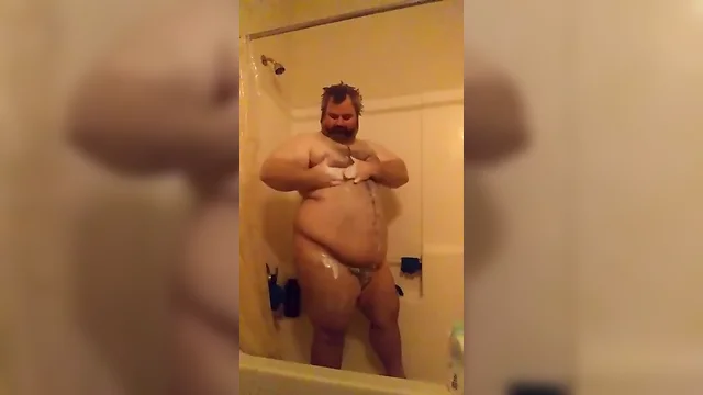 Thick man in the shower