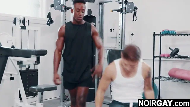 Interracial gay sex in the gym