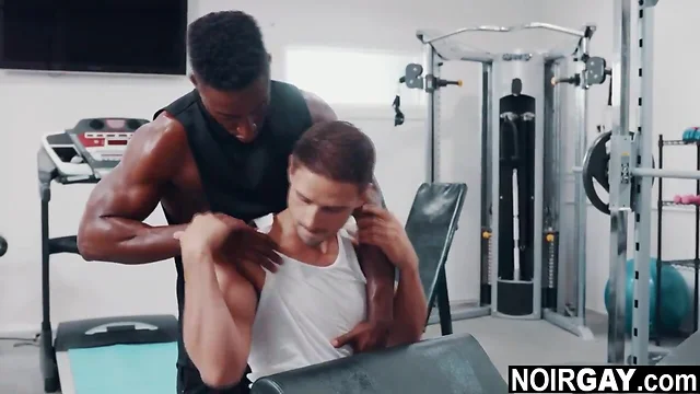 Interracial gay sex in the gym