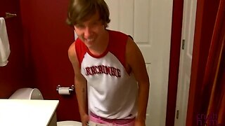 Tattooed teenager is on the bathroom floor while masturbating off