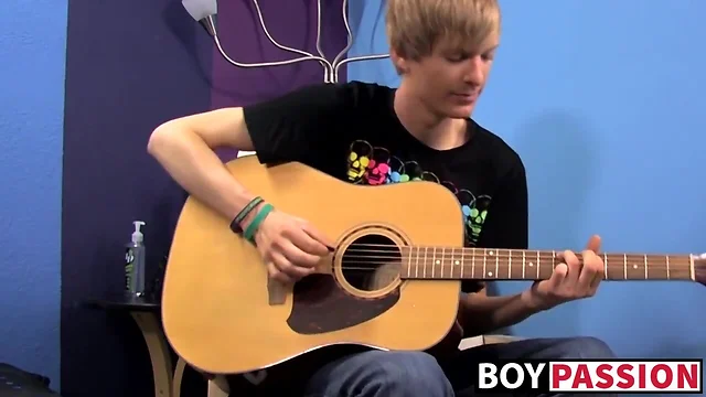Teenage man plays guitar before cock masturbating and bursting up