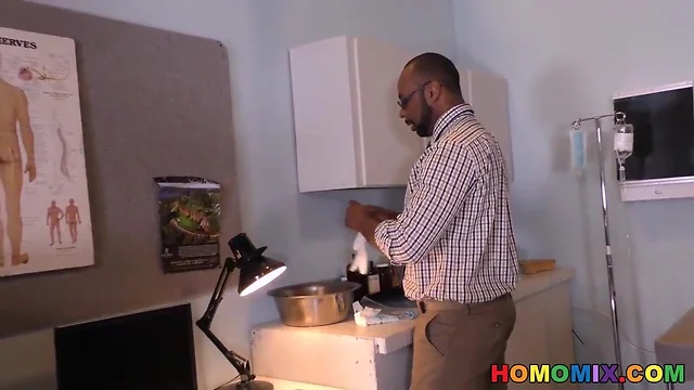 Ebony doctor removing something from the butt of a white guy