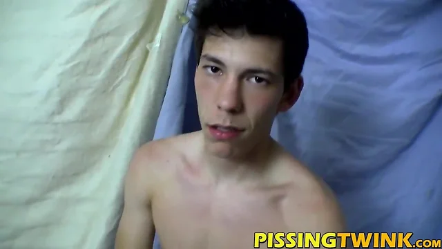 Muscly youngster pissing and wanking long prick