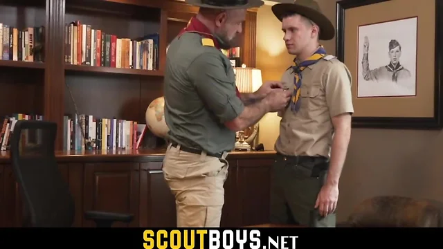 Master fingering and stroking off teen boy scout dick in his