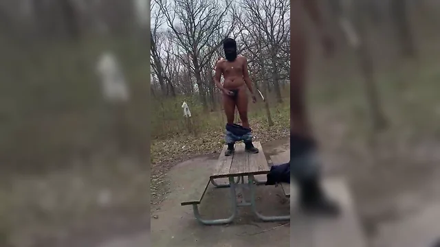Wanking and shooting on picnic table in daylight